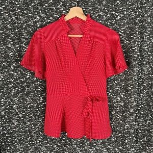 Very sweet, vintage small red and white polka dotted blouse.
